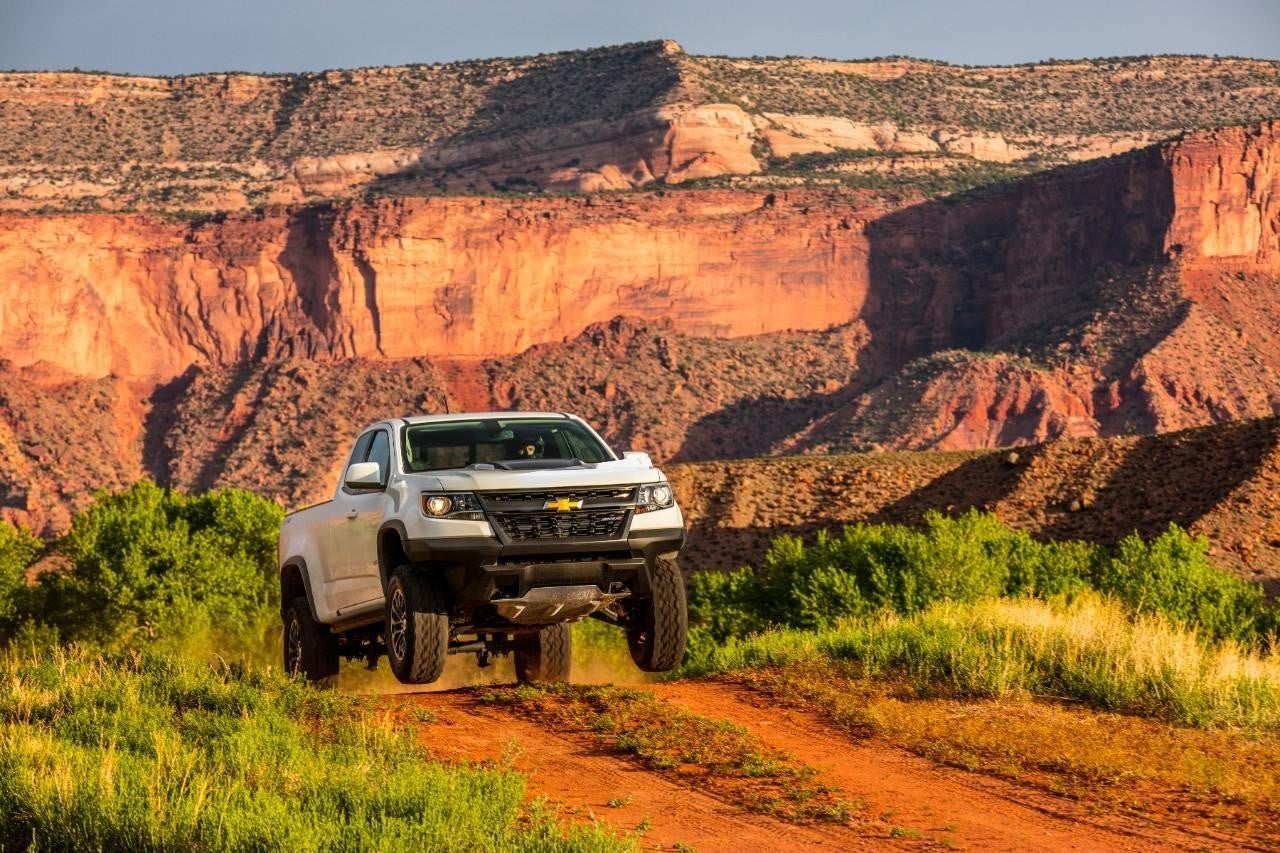 Image of White Silverado jumped over a bump in the offroad highway in DELTA UT